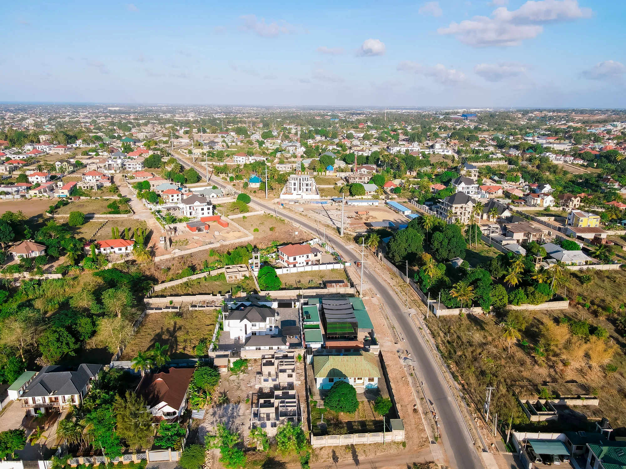 Wide drone view of the ground and the surrounding Kibada neighbourhood